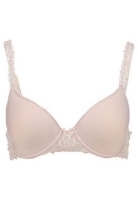 Beige padded bra with lace detailing on the sides, adjustable straps, and a small bow at the center front. Smooth texture and contoured shape.