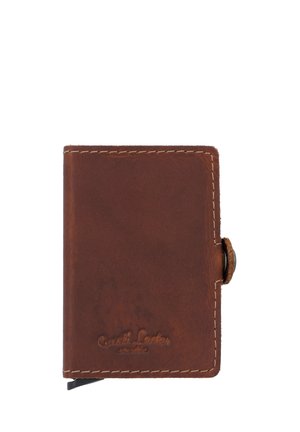 Brown leather wallet with stitched edges and a button clasp. Features embossed branding on the front and a smooth texture.