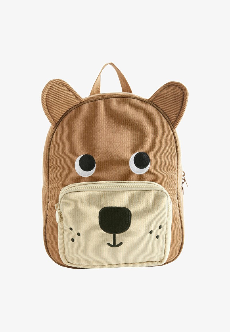 Brun korduroy rygsæk med bjørnedesign, der har store øjne, en lynlåslomme og ører på toppen. Lys tan nederste sektion med ansigtsdetaljer.
