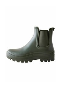 Groene rubberen chelsea boot met elastische zijkanten en een gestructureerde zool voor grip. Voorzien van een trekband aan de hiel voor gemakkelijk aantrekken.