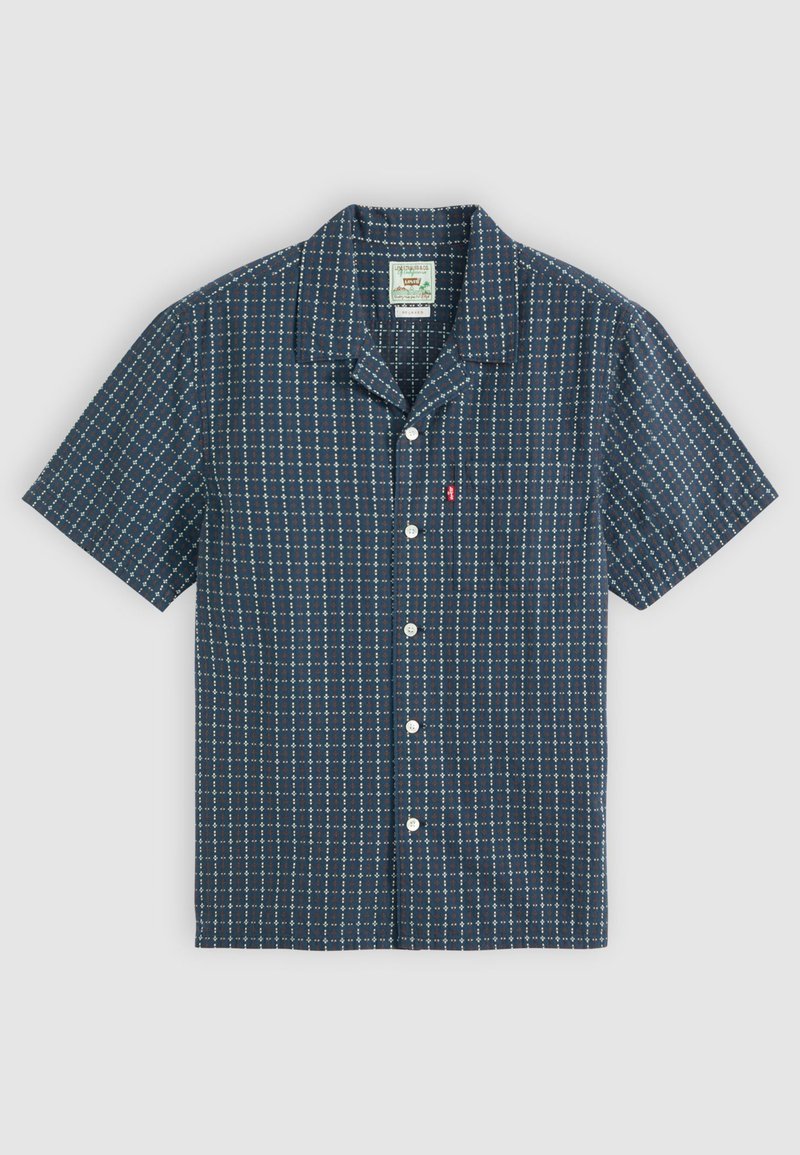 Kurzärmliges Hemd mit Knöpfen in Marineblau, mit einem geometrischen Muster aus kleinen Quadraten in Blau, Rot und Weiß. Baumwollmaterial, normaler Kragen.