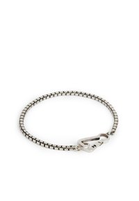 Silver bracelet with a flexible, linked design, featuring a unique clasp closure. Smooth texture, minimalistic geometric shape.