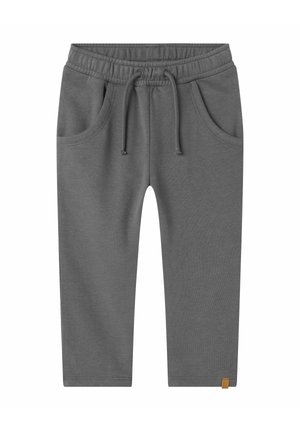 Gray cotton sweatpants with an elastic waistband, drawstring, and side pockets. Simple design with a small logo patch at the hem.