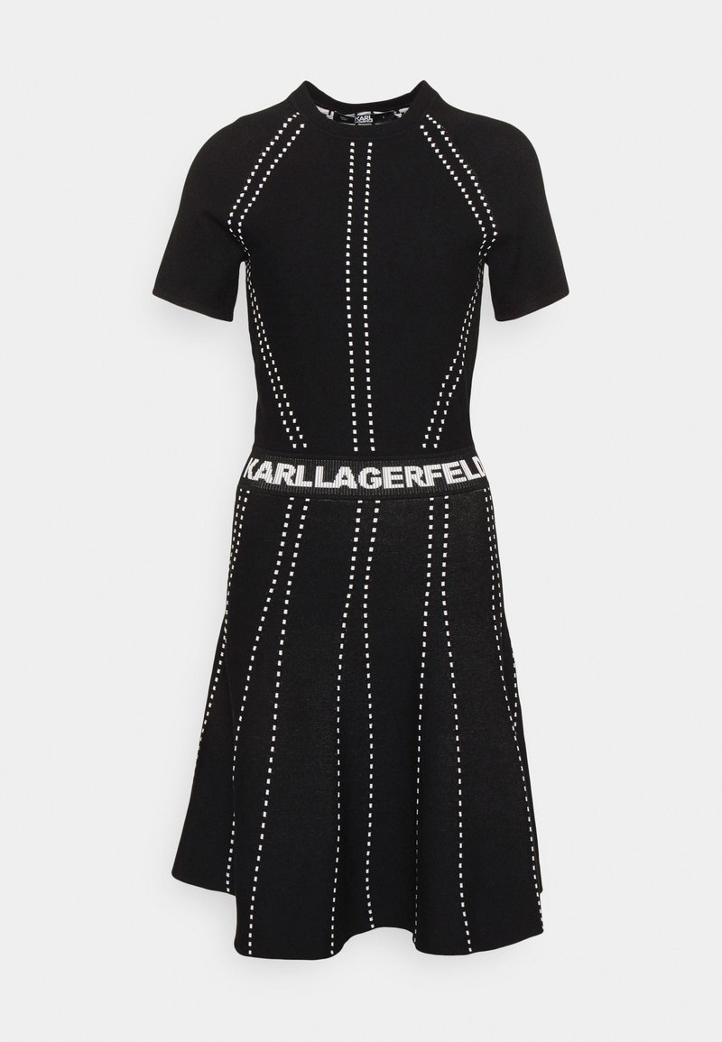 Black knit dress featuring short sleeves, a fitted bodice, flared skirt, vertical white dot patterns, and a waistband with "KARL LAGERFELD" text.