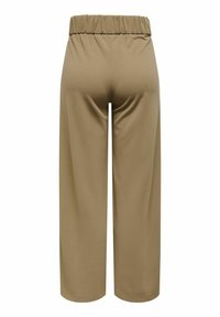 Wijde broek in een effen beige kleur. Gemaakt van zachte, gladde stof met een elastische tailleband. Eenvoudig ontwerp, geen zichtbare patronen of accenten.