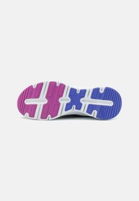 Shoe sole featuring a textured design with a white base, accented by purple and pink sections, and deep grooves for traction.