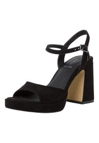 Black suede high-heeled sandals with an open toe, ankle strap and a block heel featuring a contrasting golden accent on the side.
