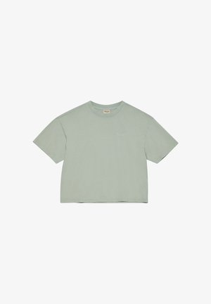 Lichtgroen, kortärmelig cropped T-shirt met ronde hals, klein geborduurd "HALO"-logo op de linkerborst en een stoffen label bij de kraag.