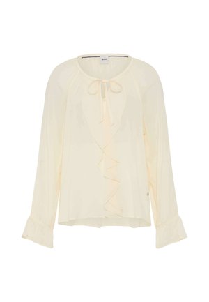 Licht crèmekleurig blouse met een gerimpelde voorkant, een striksluiting bij de hals, lange mouwen met uitlopende manchetten en een lichtgewicht, iets doorzichtig fabric.