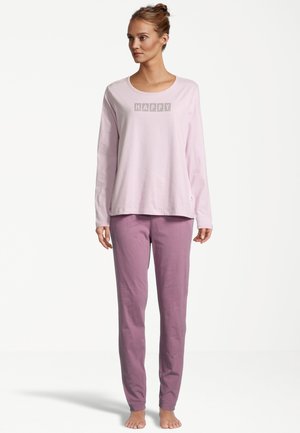 Light pink long-sleeve shirt with "HAPPY" printed in a block font; paired with light purple, tapered pajama pants. Soft cotton material.