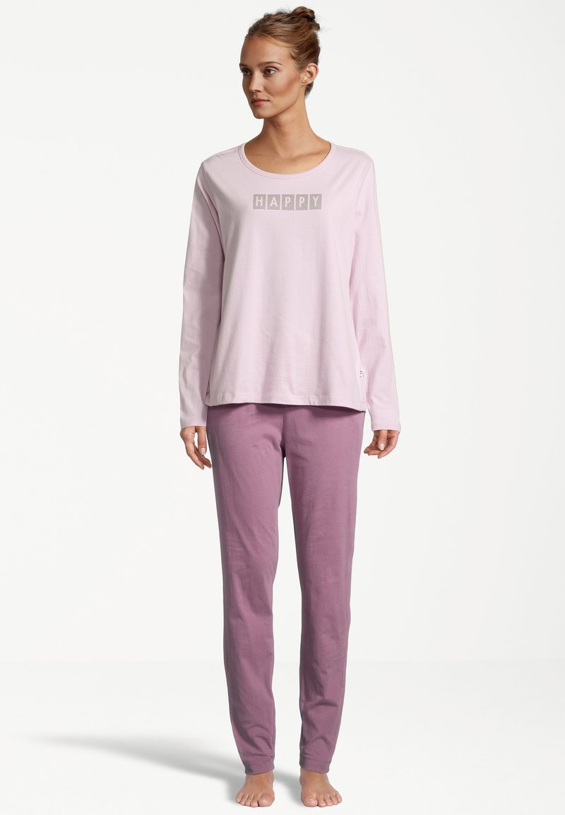 Light pink long-sleeve shirt with "HAPPY" printed in a block font; paired with light purple, tapered pajama pants. Soft cotton material.