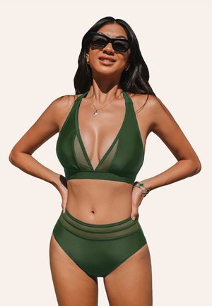 Green bikini set featuring a plunging neckline with mesh panels, high-waisted bottoms, and a smooth texture. Includes black sunglasses.