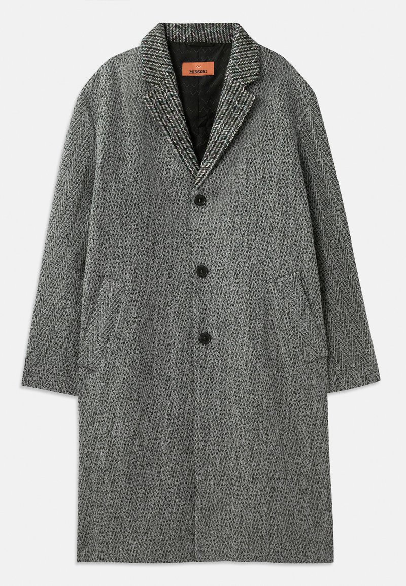 Grijze visgraatjas met een geknipt kraag, drie knopen en twee zijzakken. Gemaakt van textiel met een gestructureerde stof en een gevoerde binnenkant.