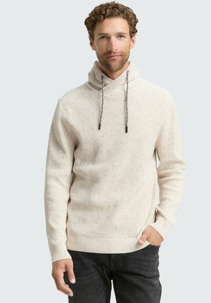 Lichtbeige gebreide hoodie met een zachte textuur, voorzien van een colkraag en trekkoorden. Opvallende spikkels over de stof.