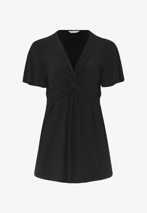 Musta lyhythihainen pusero, jossa edessä solmittu solmu ja V-pääntie, laskeutuu pehmeästi rinnan alapuolelle.