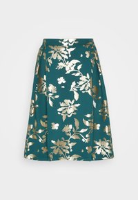 Tyrkis skjørt med gull blomsterdesign, med legg og en tettsittende midje. Den glatte teksturen og midilengden forbedrer designet.