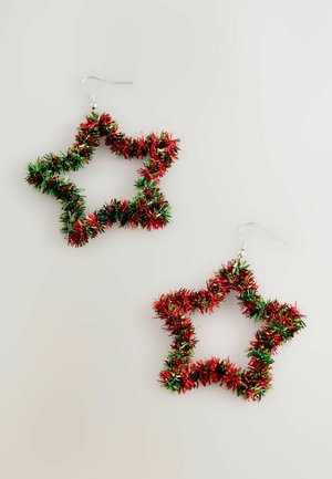 Star-shaped earrings made of red and green tinsel, featuring a shiny texture and a silver metal hook for attachment.
