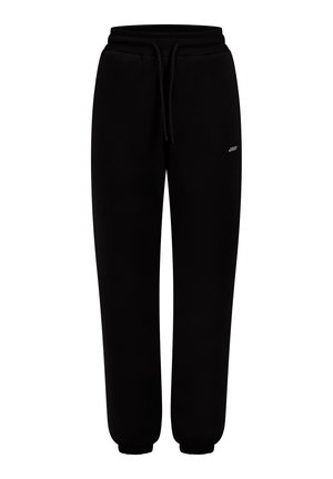 Schwarze Sweatpants aus weichem Material, ausgestattet mit einem elastischen Bund mit Kordelzug, seitlichen Taschen und gerippten Bündchen an den Knöcheln.