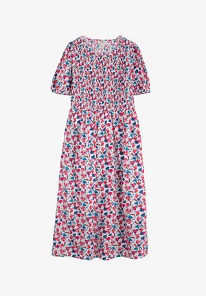 Kwiatowa sukienka z marszczonym gorsetem, krótkimi rękawami i rozkloszowanym dołem. Biała tkanina z czerwonymi, różowymi i niebieskimi wzorami liści.