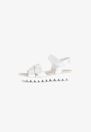 Silver leather sandals with an adjustable strap, featuring a knotted front design and a white, ridged sole for traction.