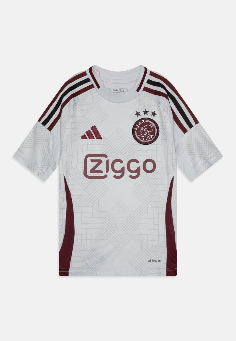 Hvid fodboldtrøje med maroon detaljer, der har et geometrisk mønster, tre sorte striber på skuldrene og logo. Fremstillet af åndbart stof.