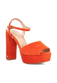 Orange suede platform sandals with a peep toe, ankle strap, and a chunky block heel. Features gold-tone hardware and a smooth inner lining.