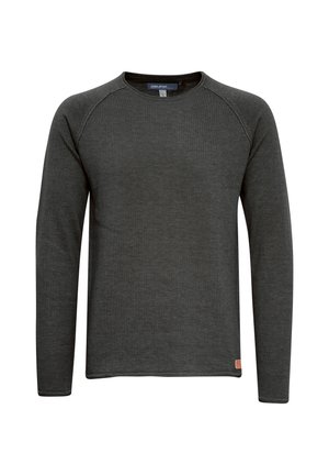 T-shirt à manches longues gris foncé en texture côtelée, avec un col rond et des manches raglan. Petite étiquette de marque en bas à gauche.