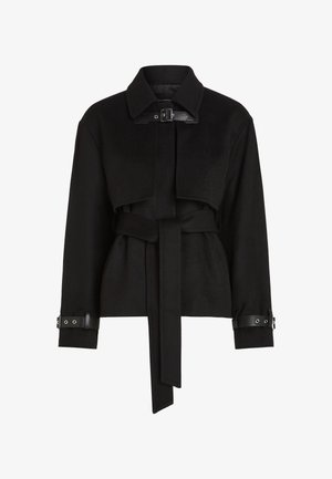 Sort cropped jakke i uldblanding med omfaldet krave, bælte i taljen og læderdetaljer på ærmerne. Har et minimalistisk design.