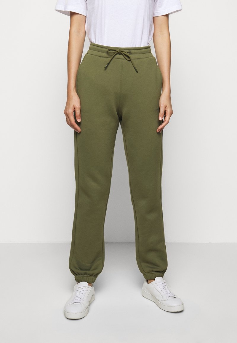 Olivegrüne Sweatpants aus weichem Material, mit elastischem Bund und Kordelzug, schmal zulaufenden Bündchen und Seitentaschen.
