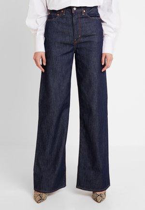 Flared jeans - rinsed denim