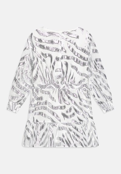 White dress with silver zebra stripes, long sleeves, elastic waist, and ruffled hem. Sheer fabric with a smooth texture and reflective finish.
