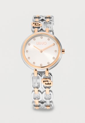 Runde silberne und roségoldene Liu Jo Armbanduhr mit minimalistischem Zifferblatt, Kristall-Stundenmarkierungen und Gliederarmband mit roségoldenen Akzenten.