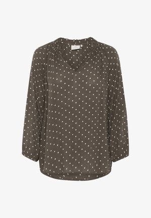 Pruunide täppidega pluus V-kaelusega, kolmeveerand varrukatega ja volditud detailidega kaeluses. Pehme, kerge kangas.