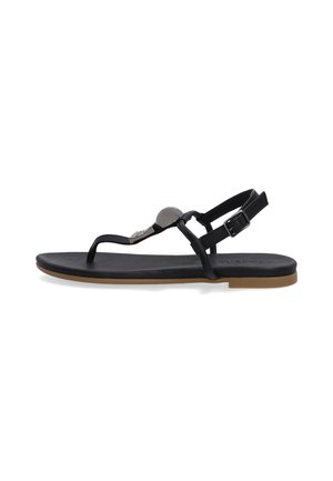 Black flat sandals with thin straps, featuring a round metallic accent, adjustable buckle, and a brown rubber sole.