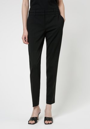 THE SKINNY TROUSERS - Housut - black