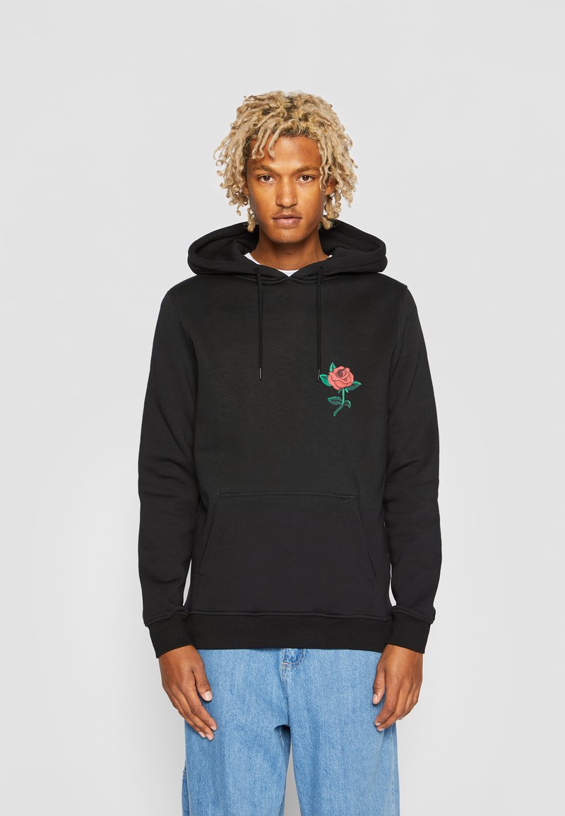 Black hoodie made of cotton, featuring an embroidered rose on the left chest, a kangaroo pocket, and adjustable drawstrings on the hood.