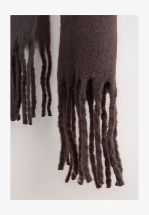 Tumepruun sall, mis on tehtud pehmest materjalist, ehitud narmastega erineva pikkusega ja tekstuurse viimistlusega.