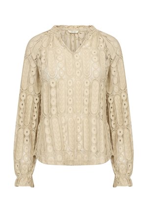 Light beige blouse made of lace fabric with intricate circular and oval patterns, featuring a V-neck, gathered sleeves, and a relaxed fit.