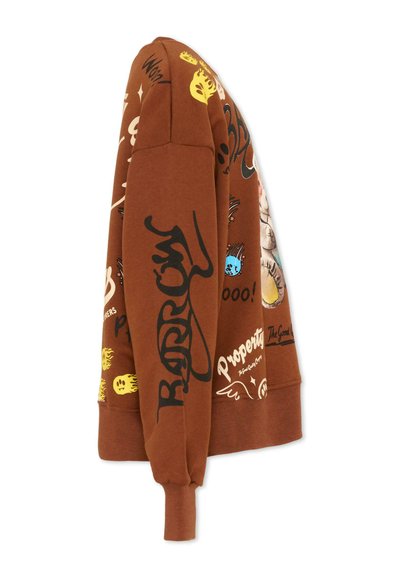 Sweat-shirt marron avec des imprimés colorés de style graffiti, comprenant du texte, des yeux, des flammes et des dessins animés, montré de profil.