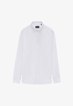 Biała, długosleeve koszula z guzikami i kołnierzykiem rozłożonym, wykonana z gładkiego materiału. Posiada metkę z logo oraz zaokrąglony dół.