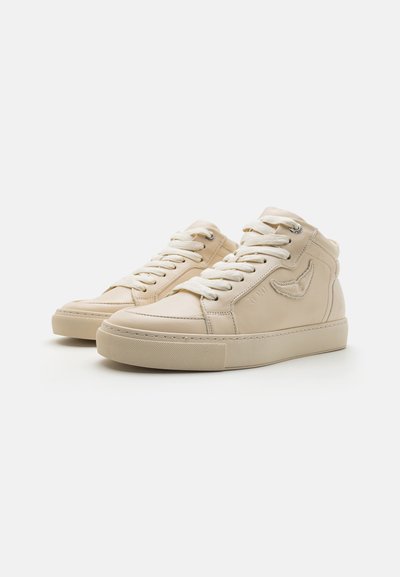 Beige leather high-top sneakers with round toe, flat laces, padded collar, and textured rubber sole featuring a subtle logo detail.