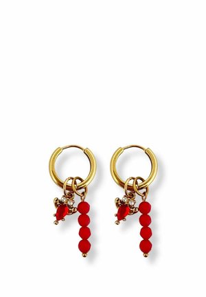 Gold hoop earrings with red heart-shaped charms, small clear stones, and three attached red beads dangling vertically.