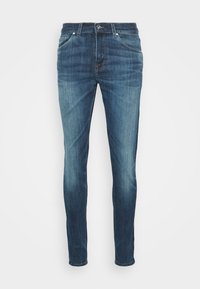 Slim-fit blå denimjeans med en blekt tvätt. Har fem fickor, dragkedja fram och metallknäppning. Slät textur med lätt stretch.