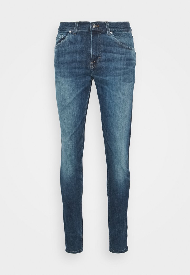 Slim-fit blå denimjeans med en blekt tvätt. Har fem fickor, dragkedja fram och metallknäppning. Slät textur med lätt stretch.