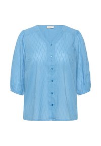 Blouse bleu clair avec un col en V, des manches bouffantes et des coutures décoratives en motif chevron. Présente des boutons bleus le long de l'avant.