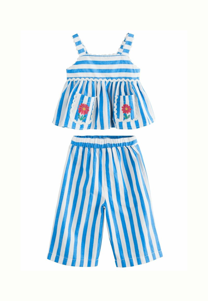 Two-piece outfit featuring blue and white vertical stripes. Top has ruffled hem, adjustable straps, and embroidered flower pockets. Pants are relaxed fit.