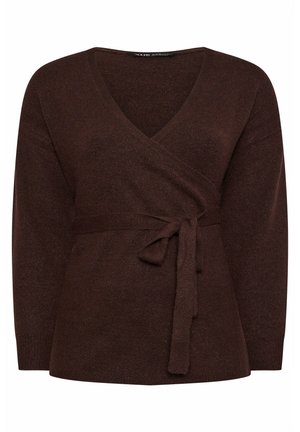 Brązowy sweter dzianinowy z dekoltem w serek, zapinany na krzyż, z długimi rękawami. Posiada pasujący materiałowy pasek związany w talii. Miękka tekstura.