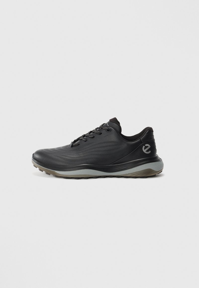 Black low-top sneaker with grey sole, lace-up front, and subtle wave patterns, featuring a small logo on the heel side.
