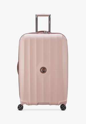Valise rigide de couleur rose clair avec une finition texturée, dotée d'une poignée télescopique, de roues pivotantes et d'un détail central avec logo.