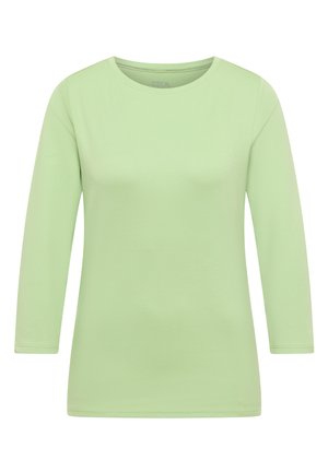 Světle zelená košile s dlouhým rukávem vyrobená z měkké látky. Má kulatý výstřih a rovný lem. Bez vzorů nebo viditelných ozdob.